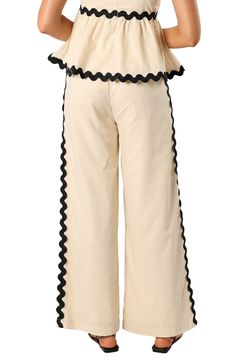 Rickrack trim adds a stunning finishing touch to these pull-on cotton pants fashioned with a high waist and flowy wide legs. Elastic/drawstring waist Lined 100% cotton Hand wash, dry flat Imported Cream Bottoms With Elastic Waistband, Cream Cotton Pants With Belt Loops, Luxury Cream Cotton Wide Leg Pants, Luxury Wide-leg Rayon Bottoms, Cream Bottoms With Elastic Waistband, Short Length, Cotton Wide Leg Pants, Rick Rack, Wide Legs, Cotton Pants