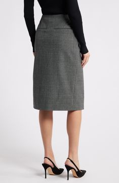 A seasonless blend elevates this classic wrap skirt shut with a statement-making buckle and boasting clean lines thanks to its paneled design. 26 1/2" length True wrap style with adjustable buckle closure 68% polyester, 29% viscose, 3% elastane Dry clean Imported Classic Workwear Skirt With Belt Loops, Classic Office Skirt With Belt Loops, Belted Asymmetrical Skirt For Workwear, Knee-length Workwear Skirt With Belt Loops, Modern Asymmetrical Pencil Skirt For Workwear, Modern Asymmetrical Pencil Skirt For Work, Elegant Belted Asymmetrical Wrap Skirt, Elegant Pencil Wrap Skirt For Work, Elegant Wrap Pencil Skirt For Work