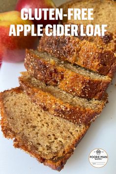 slices of gluten - free apple cider loaf on a white plate with apples in the background