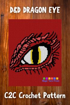 a cross stitch pattern with an image of a dragon eye on the front and side