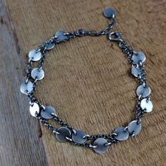 Bracelet- oxidized sterling silver, handmade jewelry, raw silver, Finished Chain Bracelet made of 925 silver. Silver oxidizes and polished. Length of the bracelet is 7.1/7.5/7.9 inches (18/19/20 cm), plus the regulatory chain 0.8 inches (2 cm). Coin have diameter 0.28 inches (0,7 cm) The bracelet is packed in an elegant box. Please write if you need changes. S H I P P I N G : If you need things for special occasions or by a certain date please ensure that you order in plenty of time as the postal system is not always reliable. I'll do my best to meet these shipping estimates, but can't guarantee them.  All objects are carefully wrapped in a bubble wrap and a box or input in elegant jewelry boxes.  The buyer may withdraw the sale/purchase contract, without giving reasons, within 14 calendar Silver Bohemian Bracelet With Multi-stone, Adjustable Nickel-free Silver Charm Bracelet, Bohemian Silver Multi-stone Bracelets, Bohemian Nickel-free Antique Silver Bracelet, Bohemian Sterling Silver Multi-stone Bracelets, Silver Handmade Jewelry, Oxidized Sterling Silver, Elegant Jewelry, Charm Bracelets