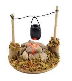 a small fire pit with rocks and lights