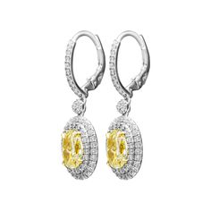 Classic, bold and elegant, these earrings will go great with evening attire or for every day wear Mounted in Platinum 950 and 18k Yellow gold cup to make Yellow Diamonds pop. These earrings feature exceptional pave work, encrusted with almost 1.7ct of white full brilliant cut diamonds creating double halo around Light Yellow Oval diamonds. Lever back also encrusted with pave, you won`t miss a sparkle! Designed and manufactured by M&V Vanguard Jewelry in 2016. Center stones details: 2 Light Y Formal Yellow Gold Oval Diamond Earrings, Luxury Yellow Gold Oval Diamond Earrings, Yellow Gold Oval Halo Earrings, Yellow Oval Halo Jewelry, Classic Yellow Oval Earrings, Oval Diamond Earring, Gold Cup, Double Halo, Evening Attire