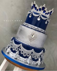 a stack of blue and silver wedding cakes on top of each other in different designs