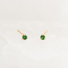 Inspired by the mystical allure of birthstones. These birthstone stud earrings feature dazzling tsavorite gemstones, expertly set in 14k yellow gold with three-prong settings.

A meaningful and stylish gift for anyone born in May.


Tsavorite (May birthstone) is the stone of compassion

Tsavorites have a width of 2.5mm 

Made with 14k yellow gold

Butterfly back closures Yellow Gold Tsavorite Gemstone Earrings, Tsavorite Gemstone Earrings For May Birthstone, Yellow Gold Tsavorite Earrings As Gift, Tsavorite Yellow Gold Earrings For Gift, Tsavorite Earrings Gift For May Birthstone, Tsavorite Earrings For May Birthstone Gift, Green 14k Gold Birthstone Earrings, 14k Gold Green Birthstone Earrings, Born In May