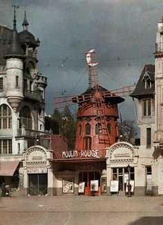 an old building with a windmill on top