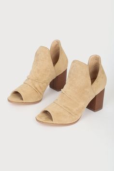 Transition through the seasons in style with the Lulus Raymay Tan Suede Cutout Peep-Toe Ankle Booties! Soft faux suede shapes these on-trend slip-on booties with a peep-toe upper, scrunched detail along the vamp, and cutouts at the instep and outstep of the ankle shaft. Stacked block heel completes the look! 3" stacked block heel. Cushioned insole. Felted rubber sole has nonskid markings. Man made materials. Imported. Lulus | Raymay Tan Suede Cutout Peep-Toe Ankle Booties | Size 10. Spring Ankle Booties With Stacked Heel, Suede Ankle Boots With Wrapped Heel, Spring Booties With Wrapped Heel, Suede Ankle-high Heels With Wrapped Heel, Suede Open Toe Booties With Stacked Heel, Suede Booties With Stacked Heel, Closed Toe, Suede Open Toe Booties Medium Width, Suede Open Toe Booties For Spring, Open Toe Suede Booties For Spring