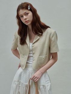 This is a modern and feminine jacket by SIEERING that is made out of high quality and sturdy material. With distinctive mood of the design and comfortable wear, you can style it for your casual daily outfit.- Binding finishing inside- Clean design and unique button- Feminine and romantic mood Beige Office Blazer With Button Closure, Casual Beige Blazer With Button Closure, Spring Beige Outerwear With Buttons, Casual Beige Outerwear With Single Button, Casual Beige Single Button Outerwear, Chic Cropped Beige Jacket With Pockets, Beige Blazer With Lapel Collar And Button Closure, Beige Single Button Blazer For Spring, Fitted Casual Cropped Jacket In Beige