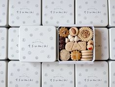 a white box filled with lots of different types of cookies