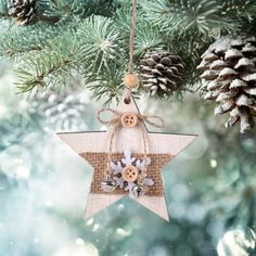 a wooden star ornament hanging from a christmas tree