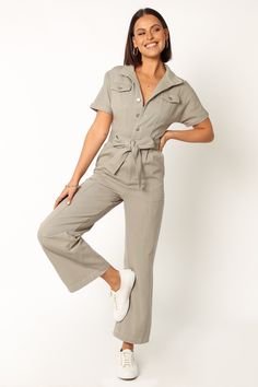 DETAILS    Introducing the perfect addition to your casual wardrobe: our Demi Jumpsuit! With its V-neckline, collared neckline and short sleeves with rolled cuffs, this jumpsuit is sure to become your new go-to.   v neckline  collared  short sleeves with rolled cuff  functional chest pockets  functional buttons down front  belt loops  detachable waist tie  functional side pockets  functional back pockets  straight leg style  unlined   material - 100% cotton    SIZING     model is 5' 7" and wears Green Playsuit, Cat Jumpsuit, Satin Dresses Long Sleeve, Petal And Pup, Black Tie Wedding Guests, White Dress Shoes, Night Tops, Essential Dress, Crop Top Tees