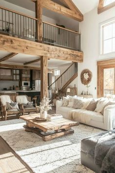 a living room filled with furniture and lots of windows