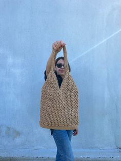 This crochet raffia tote bag is made with natural beige paper rope. Made with crochet.  It is big size, lightweight and durable. I made this Boho Straw Beach Bag for women who want to look trendy and stylish. You can use it on your shoulder.   The inside of this large raffia shoulder bag is ideally sized for beach or daily use. It's not lined.  This crochet raffia tote bag is great gift for birthday, mother's day, and other special occasions. The straw beach bag's measures; Width: 13,5 inches (3 Neutral Crochet Bag With Braided Handles, Neutral Rectangular Crochet Bag With Braided Handles, Neutral Woven Crochet Tote Bag, Eco-friendly Sand Crochet Bag For Everyday Use, Eco-friendly Neutral Crochet Tote Bag, Cream Rectangular Crochet Jute Bag, Cream Rectangular Jute Crochet Bag, Rectangular Cream Jute Crochet Bag, Neutral Crochet Bag With Braided Handles For Daily Use