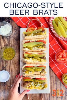 the chicago style beer bratwursts are loaded with pickles, tomatoes and onions