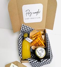 a box filled with fries, mustard and ketchup on top of a table