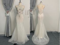 two mannequins are shown in front of curtains and drapes on display