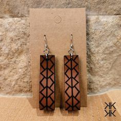 "Initial/Single Monogram Earrings! Natural leather earrings laser cut and engraved with a pattern using a single letter/initial. Leather loop earrings are light weight, versatile, and feature the pattern on both sides. Earrings are available using any letter of the alphabet and you will indicate your choice in the personalization section.  Earrings are laser cut out of leather with an oiled finish. Earring is approximately .5\" wide x 1.875\" tall with a total drop length of approximately 2.5\". Monogram Earrings, Letter Earrings, Initial Earrings, Single Letter, Loop Earrings, Earring Hooks, The Alphabet, Stainless Steel Earrings, 22k Gold