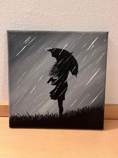 a black and white painting of a person holding an umbrella in the rain with grass