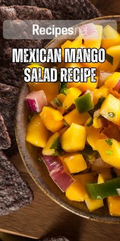 mexican mango salad recipe in a bowl with tortilla chips on the side and text overlay