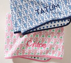 three personalized cloths are stacked on top of each other