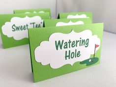 three green greeting cards with the words watering hole and golf ball on them, sitting next to each other