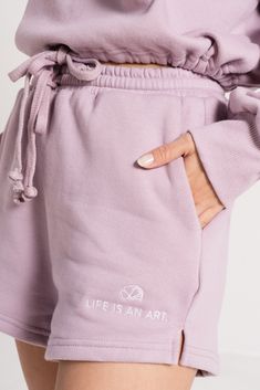 The Artist of Life Lounge Set is a sweater and sweat shorts set created for you to wear as a reminder of your power as an artist of life. Featuring a cozy, relaxed, and flexible fit, it comes in two colors: lavender and beige with embroidery that reads “Artist of Life” and “Life is an art.” This is a limited edition item. 100% cotton. Made ethically & locally in Los Angeles Top and bottom sold separately Have a question? Check out the FAQ! Relaxed Fit Spring Activewear For Relaxation, Relaxed Fit Activewear For Spring Relaxation, Spring Athleisure Shorts For Relaxation, Cotton Athleisure Shorts For Relaxation, Casual Lavender Activewear For Summer, Lavender Casual Activewear For Summer, Purple Cotton Activewear For Spring, Casual Purple Activewear For Loungewear, Lavender Athleisure Activewear For Loungewear