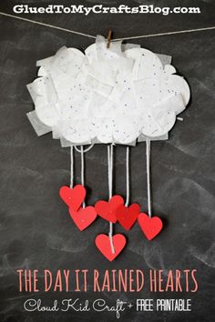 some paper hearts hanging from a clothes line on a chalkboard with the words cloud