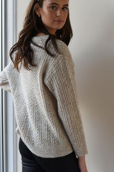 Oversized cable sweater with a boat neckline. Cozy soft fabric.Model is 5' 9" and wearing size Small Chic Beige Cable Knit Sweater, Oversized Cotton Cable Knit Top, Beige Cable Knit Crew Neck Sweater, Oversized Cream Cable Knit Top, Beige Cable Knit Long Sleeve Sweater, Cute Sweaters For Fall, Cable Sweater, Boat Neckline, Beige Sweater