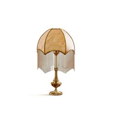 a gold lamp with a white shade on it