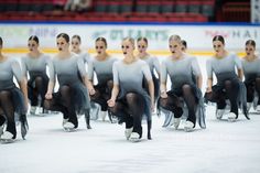 a group of women skating on an ice rink