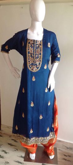 Navy blue georgette kurta with beautiful intricate hand embroidery with a matching dupatta. The dupatta has all over embroidery too. Thepajama is orange brocade in patiyala style. This is a unique and stunning piece suitable for all celebrations. Available in custom colors. Hand Embroidered Dupatta, Georgette Kurta, All Over Embroidery, Kurti Sets, Floral Lehenga, Sequin Blouse, Embroidered Dupatta, Blue Hand, Embroidery Blouse