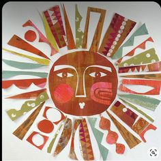 an art project made out of colored paper and cut into the shape of a sun