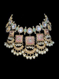 "Palavi Enameled Meenakari Bridal Set Regardless what the occasion be this set is versatile for all your outfits. Wear the beautiful enameled Meenakari set during your mehndi & sangeet event. The colours of this set work with all colours. Exquisite kundan craftmanship along with those pastel droplets makes this set a complete showstopper. A classic set of jadau kundan and enameled motifs strung in harmony with faux pearl beads. The necklace comes along with beautiful pair of earrings. Approx Kundan Necklace With Motifs In Temple Jewelry Style, Temple Jewelry Enamel Wedding Jewelry, Enamel Temple Jewelry For Weddings, Multicolor Chandbali Kundan Necklace With Motifs, Kundan Bridal Necklace With Motifs For Festivals, Multicolor Kundan Necklace With Gota Work, Bollywood Kundan Jewelry With Motifs, Bollywood Style Kundan Jewelry With Motifs, Multicolor Chandbali Jewelry With Gota Work