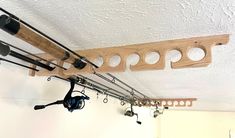 fishing rods and reels hanging from the ceiling