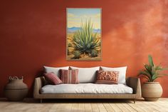 a living room scene with a couch and potted plants