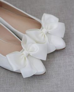 Chic satin pointy toe flats with oversized satin bow. Perfect simplicity for bride and wedding party. Detail:COLORS AVAILABLE: White, Ivory, Blush Pink, Champagne, Rose Gold Metallic, Aqua Blue and Royal Blue SatinUPPER: Synthetic upper and liningMATERIALS: Mandmade outsole STYLE NAME: VANITA