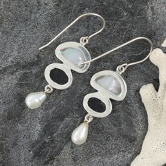 These Sterling Silver Earrings feature White Keshi and Fresh Water Pearl, Paua Shell 7x9 Oval- all set into 3.5 grams of sterling silver Unique Sterling Silver Pearl Drop Earrings, Handmade Distinctive Silver Pearl Earrings, Handmade Silver Pearl Earrings, Unique Handmade Silver Pearl Earrings, Hallmarked Sterling Silver Dangle Pearl Earrings, Silver Teardrop Mother Of Pearl Earrings, Unique Silver Pearl Drop Earrings, Silver Mother Of Pearl Round Pearl Earrings, Silver Mother Of Pearl Dangle Earrings