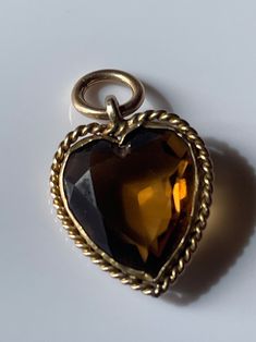 Antique citrine charm heart pendant, 2cms. Tested for 9ct. Antique Heart-shaped Yellow Gold Jewelry, Antique Yellow Gold Heart Cut Jewelry, Antique Yellow Gold Jewelry With Heart Charm, Victorian Vintage Charm In Yellow Gold, Victorian Yellow Gold Vintage Charm, Antique Heart Pendant In Yellow Gold, Vintage Charm Heart-shaped Yellow Gold Jewelry, Antique Yellow Gold Heart Pendant Jewelry, Victorian Heart-shaped Charms Jewelry