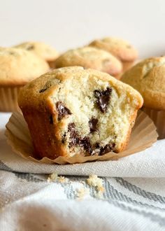 several muffins sitting on top of a white napkin