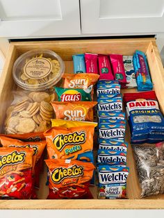 an open drawer filled with snacks and chips