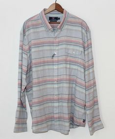 Vineyard Vines Button Down Shirt. New Without Tags. Slim Fit "Crosby". Cotton and Linen Soft Blend. Button Down Collar. Pastel Stripe Pattern. Men's XXL. -Measurements- Pit to Pit - 26.5" Shoulder to Shoulder - 20" Sleeves From Shoulder Seam - 25.5" Length From Base of Collar - 30" Pastel Stripes, Stripe Shirt, Button Down Collar, Vineyard Vines, Striped Shirt, Stripes Pattern, Casual Button Down Shirts, Button Downs, Vines