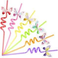 six colorful butterfly shaped straws on a white background