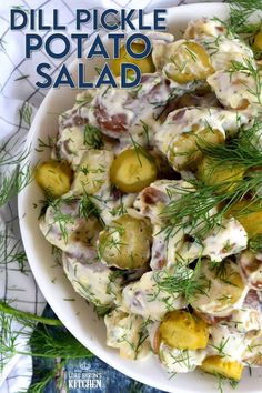 a white bowl filled with potato salad on top of a blue and white table cloth