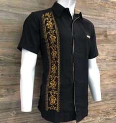 Beautiful Elegant Handcrafted Guayabera Shirt  Black Linen Fabric with Gold Embroidery   Pumpkin Flower Embroidery Design Beige Contrast on Neckline  Hand Made in Merida Yucatan Mexico 100% Fine Linen Short Sleeve  High Quality Shirt 100 % Brand New  Good For: Formal Wear, Weddings, Birthday Present, Fathers Day, Vacation, Casual, Special Event etc.  Give us a try...  Thank You and God bless you. Mens Embroidery Designs, Guayabera Outfit For Men, Black Linen Shirt Men, Guayabera Outfit, Embroidery Shirt Men, Formal Shirt Design, Black Linen Shirt, Man Dress Design, Mens Shirt Pattern