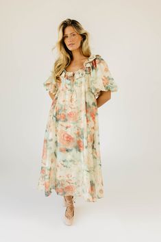 this vintage-inspired puff sleeve maxi dress is guaranteed to be your new go-to. it features a dainty ruffle neckline, dramatic puff sleeves, + a chic muted abstract floral pattern. with its relaxed silhouette + flowy shape, it’s the perfect maxi dress to pair with your favorite heels, boots, sandals, or sneaks. watercolor floral // scoop neckline, front tie, dramatic puff sleeves, pockets, contrast stitching on collar, lined model is 5'8" + wearing a small measurements are approximate + taken w Billowy Puff Sleeve Midi Dress With Ruffles, Billowy Midi Dress With Ruffles And Puff Sleeves, Billowy Puff Sleeve Dress For Daywear, Feminine Billowy Puff Sleeve Dress For Daywear, Puff Sleeve Maxi Dress With Ruffles For Garden Party, Spring Balloon Sleeve Maxi Dress For Daywear, Feminine Puff Sleeve Midi Dress, Feminine Billowy Puff Sleeve Dress, Billowy Puff Sleeve Maxi Dress For Daywear