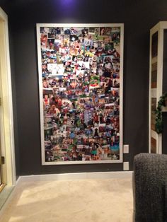 a living room with a large poster on the wall and a chair in front of it