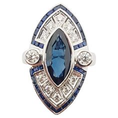 Blue Sapphire 2.62 carats with Diamond 0.49 carat and Blue Sapphire 1.30 carats Ring set in 18 Karat White Gold Settings Width: 1.5 cm Length: 1.7 cm Ring Size: 55 Total Weight: 10.72 grams "We first opened doors in 1980 when it was then situated in the vicinity of the Victory Monument; a small and modest storefront with a couple of counters. From its humble beginnings to where it stands today, our company has proven its abilities as a jeweler. Since the beginning, we have been supplying fine qu Luxury Blue Marquise Cut Jewelry, Blue Platinum Art Deco Diamond Ring, Blue Marquise Brilliant Cut Jewelry, Art Deco Blue Diamond Ring, Blue Diamond Art Deco Ring, Blue Art Deco Diamond Ring, Classic Blue Marquise Sapphire Ring, Blue Sapphire Ring With Multi-stone Baguette Cut, Blue Sapphire Multi-stone Baguette Ring