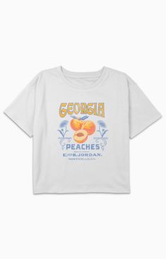 Online only! The Kids Georgia Peaches T-Shirt showcases a sweet and playful design inspired by Georgia's famous peaches. With a crew neckline, short sleeves, and a comfortable fit, it's a delightful choice for young ones to show their love for this iconic fruit and state.


	Solid color tee
	Short sleeves
	Crew neckline
	Front graphic
	Regular fit
	60% Cotton, 40% Polyester
	Machine washable Cute Peach T-shirt With Letter Print, Cute Peach T-shirt With Graphic Print, Peach Graphic Tee Short Sleeve, Peach Graphic Tee With Short Sleeves, Peach Short Sleeve Graphic Tee, Georgia Peaches, Peach Shirt, Kids Graphic Tees, Pant Shirt