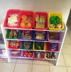 a shelf filled with lots of different types of food and containers on top of it