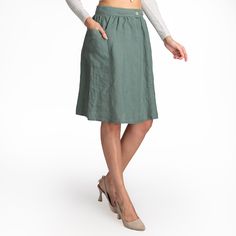 We use GOTS, OCS, GRS, European Flax and Oeko Tex certified linen fabrics. All of our products are handmade from 100% LINEN.  Product Description  - A-line skirt - Mid Waist - Side one pocket - Button closure - Knee length - Relaxed fit - Casual - It is cut and sewn specifically for you by us. - The color seen in the photo is Olive - Model is 5′8″ (178cm) tall, chest size 92cm/36.2″, waist size 75cm/29.5″, hip size 104cm/40.9″ - Wears M 🧼 Washing - Drying Process 🧼 The product has been washed and softened. It will not shrink when you wash it according to the rules. You can machine wash in cold water at 30o on a delicate program. You will get the best results if you hang it to dry. Dry it in the dryer at low temperature and on a short program. However, if you prefer to iron it, iron it on Knee-length Denim Skirt With Button Closure, Knee-length Skirt With Button Closure, Fitted Skirt With Buttoned Pockets For Spring, Casual Full Skirt With Button Closure, Casual Full Skirt Bottoms With Button Closure, Fitted Summer Skirt With Buttoned Pockets, Relaxed Skirt With Buttoned Pockets For Spring, Spring Knee-length Pencil Skirt With Pockets, Knee-length Pencil Skirt With Pockets